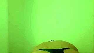 Sissy Peckey in fishnet stockings with a plug for extra pleasure