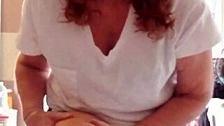 The nude beauty of a mature woman with lotion on her skin