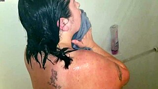 Big beautiful woman gets a facial while taking a shower