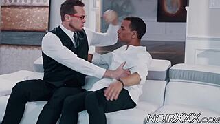 A handsome and intelligent businessman with glasses has a young and hot black gay