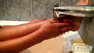 Carla’s small breasts and wet pussy are revealed in this shower scene