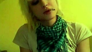 Pretty girl playing video games while smoking a cigarette