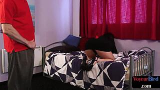 A voyeur MILF masturbates while watching a man in the next room