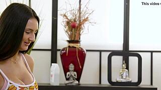 Aidra Fox and Eliza Ibarra have fun with an oil massage on a massage table