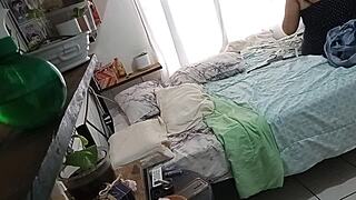 A mature and curvaceous woman cleans her bedroom