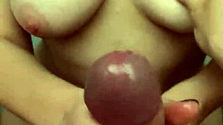 Steamy scene of a chubby girlfriend giving a male a sensual handjob and balls massage