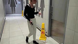 A friend seduces her friend in a public restroom and they have sex