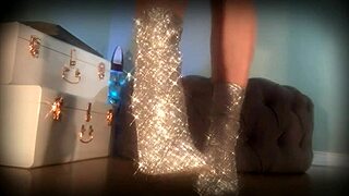 Goddess in sparkle boots dominates and entranced her loyal slave