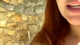 Redhead’s swollen pussy is stimulated live on cam