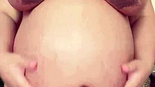 Pregnant maid's solo session with big tits and hairy pussy