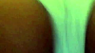 A girl in small panties is dancing and showing her big pussy