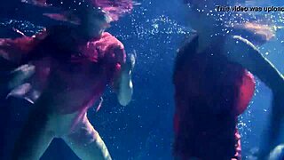 Lilia Mihalkova and Natalia Kupalka as underwater lesbians in tight swimwear