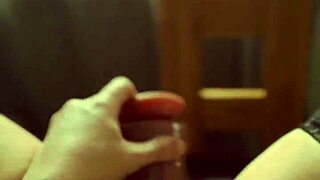 Blonde milf teases with wet pussy play at window, talking dirty