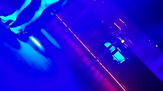 The go-go dancer pulls a married brunette to dance and lifts her dress