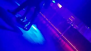 The go-go dancer pulls a married brunette to dance and lifts her dress