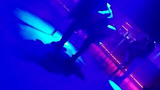 The go-go dancer pulls a married brunette to dance and lifts her dress