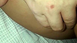 She slides a dildo into her ass for anal fucking.