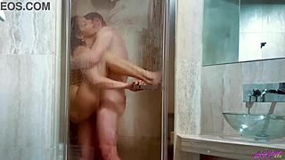 He bends over in the wet shower