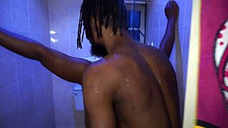 Blonde in bathroom shower sucks big black cock and swallows cum