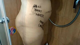 Pregnant babe plays with big tits during steamy shower masturbation