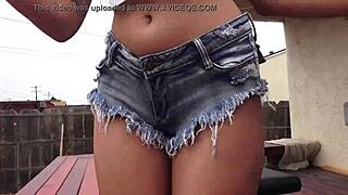 Asian babe teases with incredible big ass in tight shorts outdoors