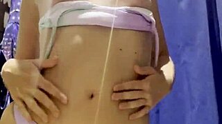 Hidden camera catches young latina exposing tits in department store fitting room!