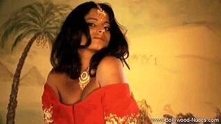 a seductive indian woman performs a striptease to seduce a man