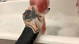 Blonde teen relaxes in bubble bath on webcam