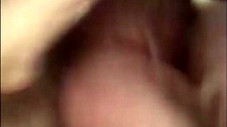 Blonde milf chats casually in satin lingerie during home video