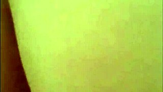 Blonde milf chats casually in satin lingerie during home video