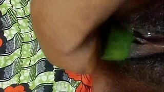 hey, check out cyndy blackslave using a cucumber to fuck her pussy and squirt on webcam