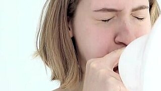 young looner babe blowing and popping her first balloon