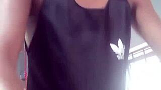 Two young guys exchange looks at gym