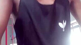 Two young guys exchange looks at gym