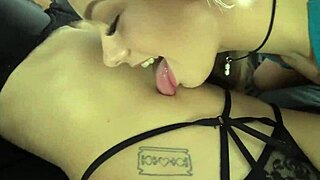 Lesbians in lingerie worship each other's belly buttons with kisses and licks