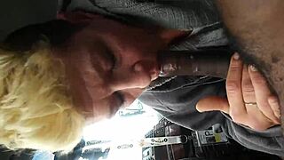 She's about to swallow a massive black nut deep throat