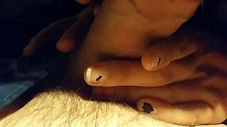 The stepsister is sucking her stepfather's cock, leading to a cumshot.