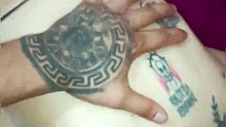 Beautiful Tattooed Woman Bent Over in Thong Swallowing Huge Cock