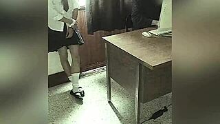 Camera Records Teacher And Student In School Office