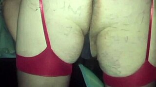 gay man in red stockings rubs his little dick and shows huge ass