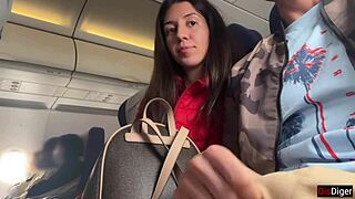 Brunette jerks off publicly on a crowded plane