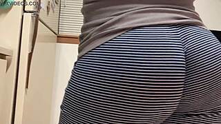 Kitchen solo with a mature woman and an emphasis on her fat ass
