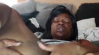 Ebony babe teases with striptease before squirting