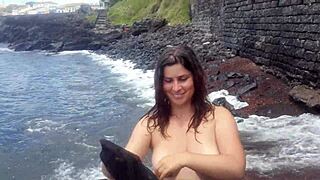 My stepmom relaxing on a public beach with natural curves