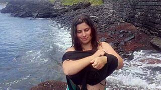 My stepmom relaxing on a public beach with natural curves