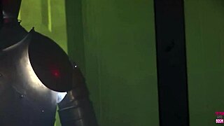 Two lesbian vampires kiss in costumes and stockings