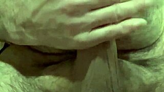 Solo guy plays with foreskin and balls then shoots load into camera