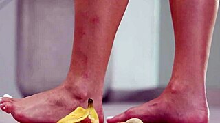 petite brunette crushes fruits with bare feet in heels