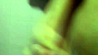 Young guy jerks off solo, stroking his cock from base to tip repeatedly until cumming