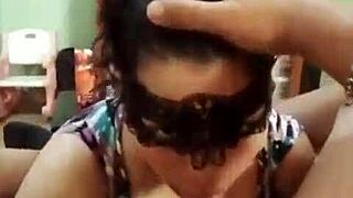 masked woman performs deepthroat blowjob intensely